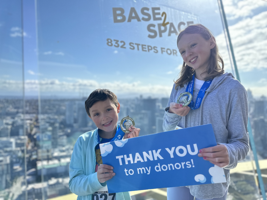 Addie and Tallinn with thank you sign