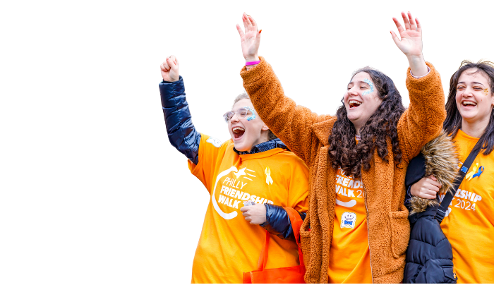 teens cheering with hands in the air