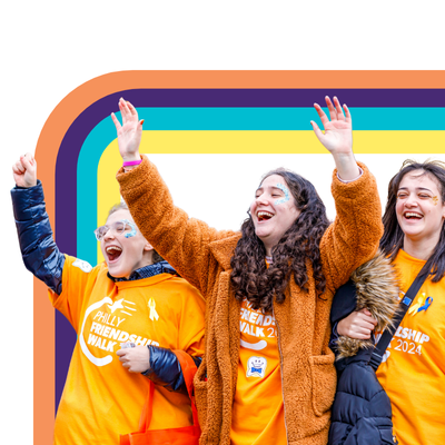 teens cheering with hands in the air