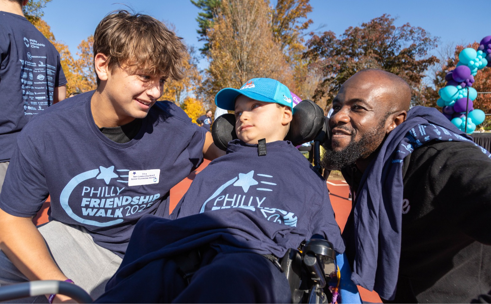 friends pose together smiling