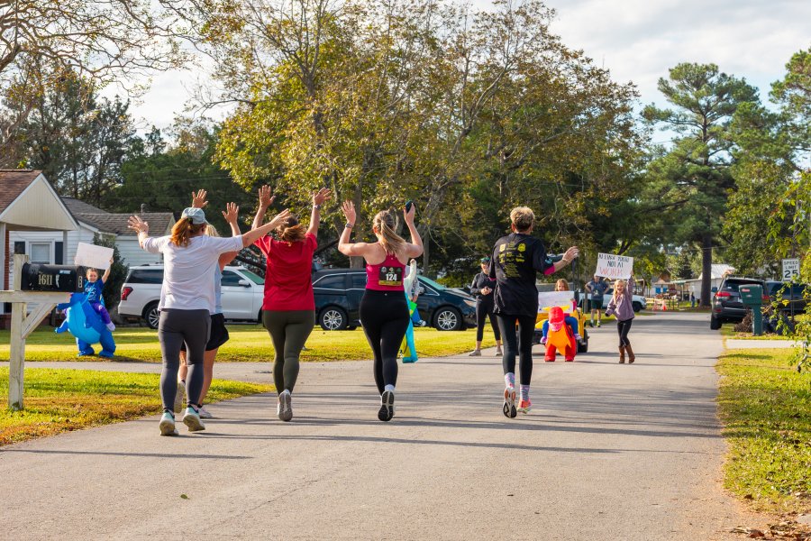 Runners being cheered on by spectators