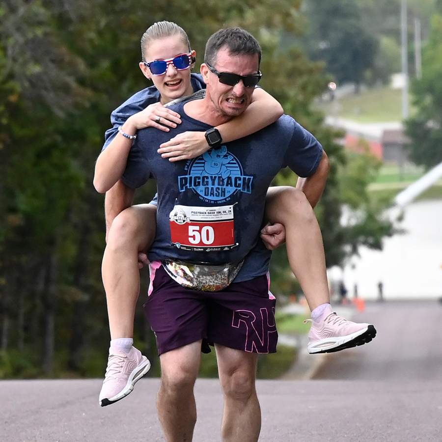 Runner carrying someone piggyback