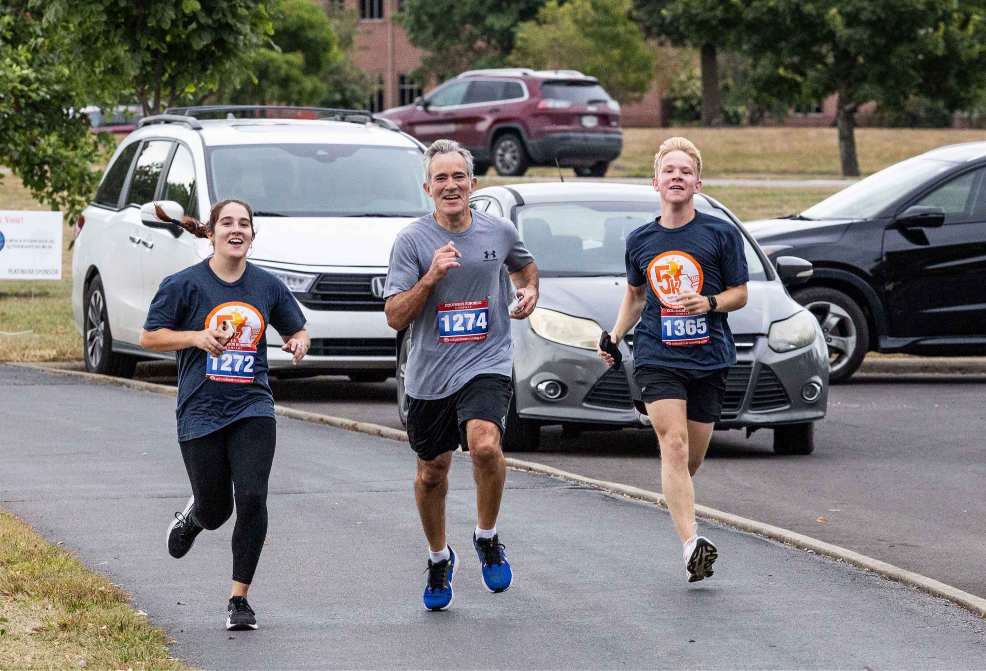 Photo of 3 runners finishing the 5K