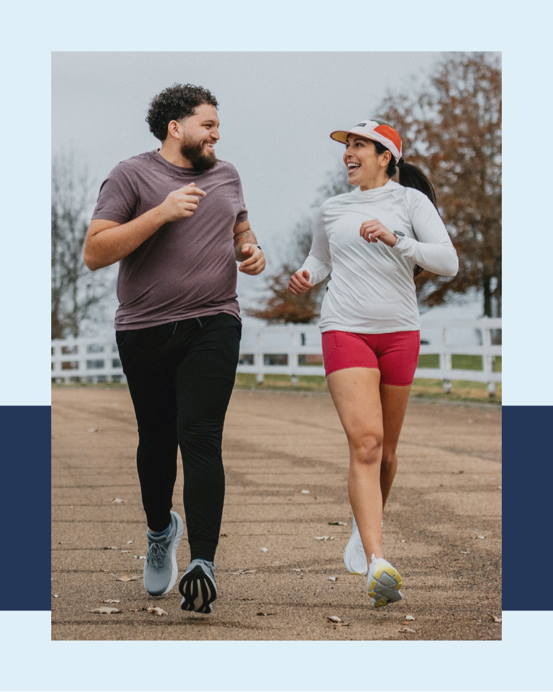 man and woman running side by side laughing with each other