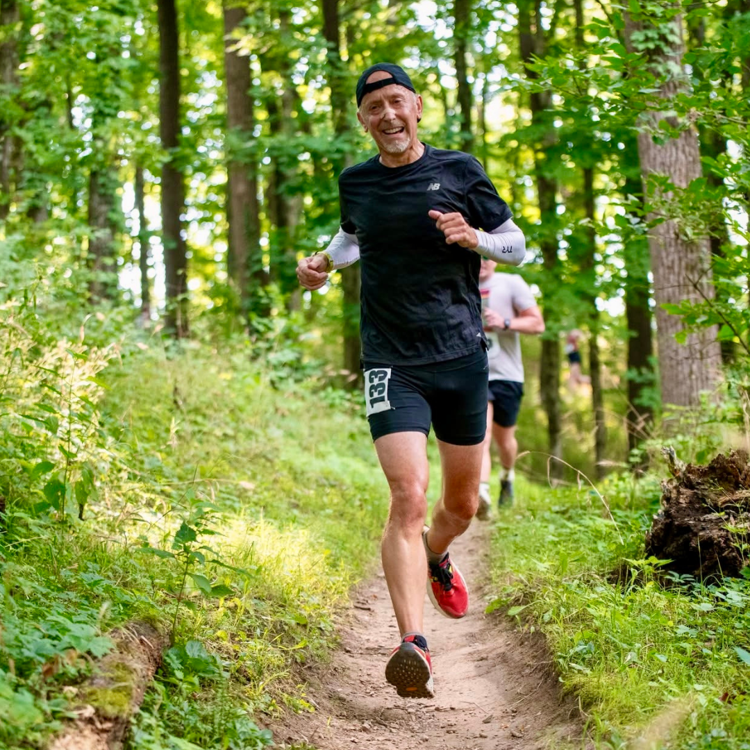 markus dennis running in the woods