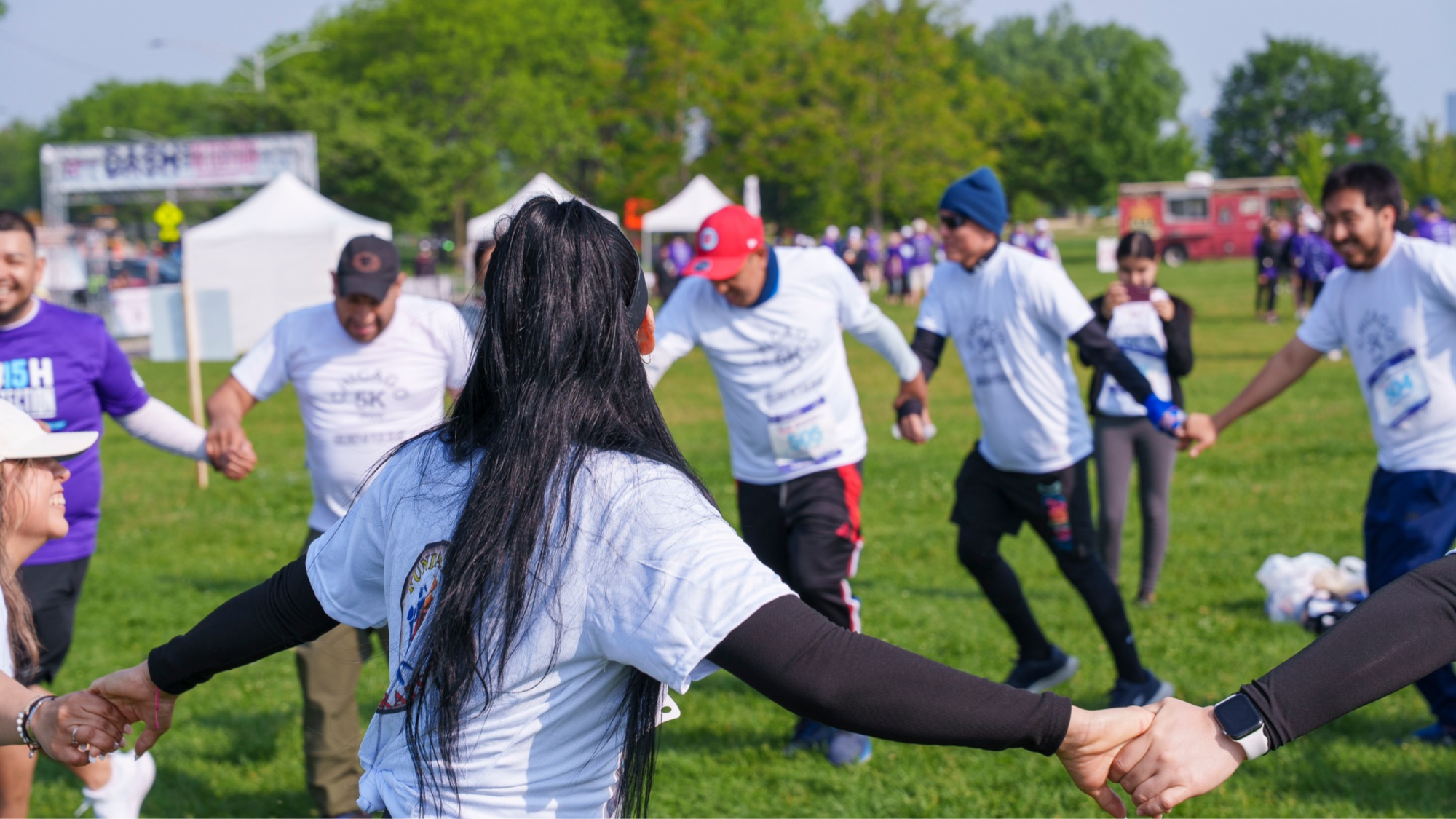 people in a circle holding hands