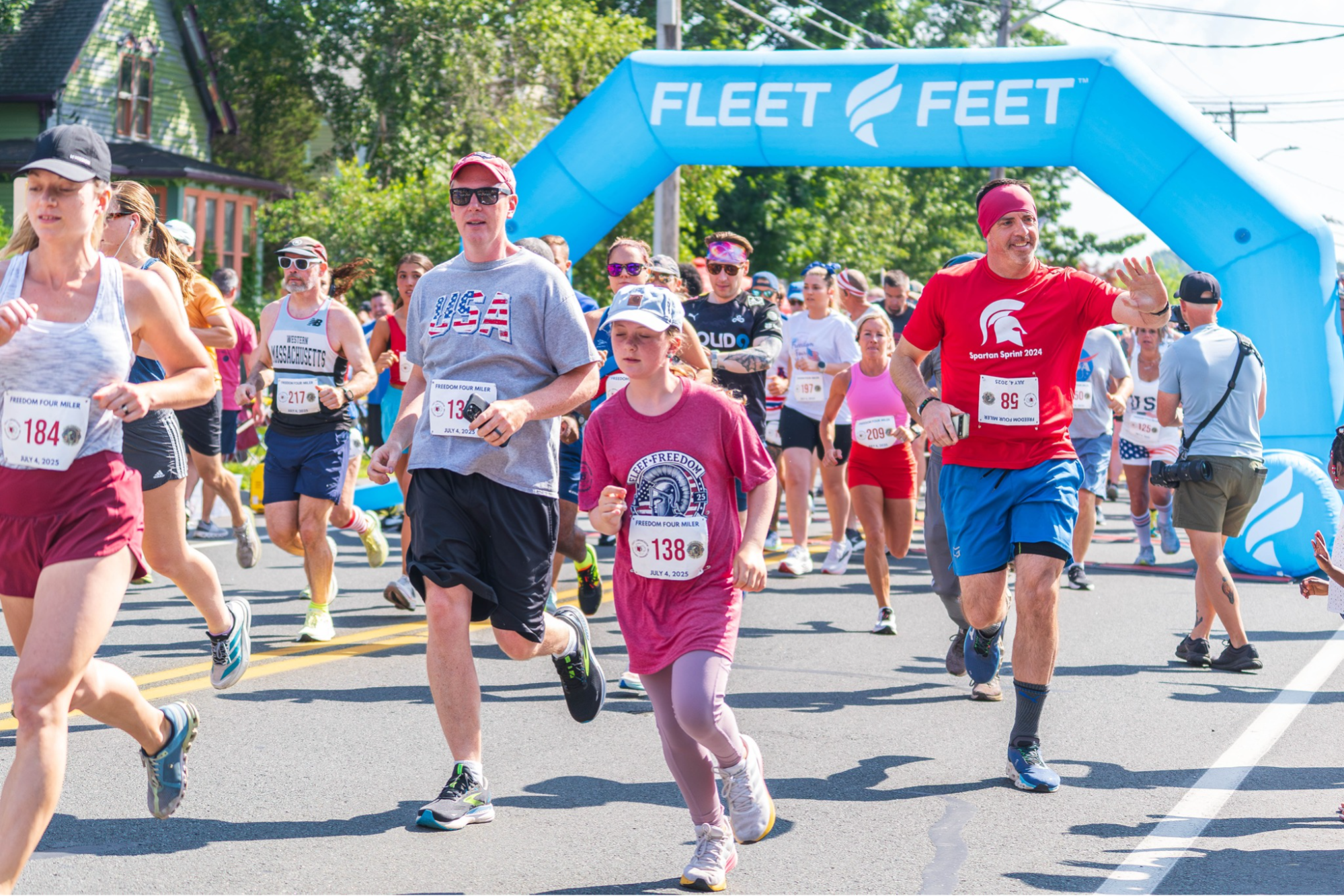 Runners leaving the starting gate in road race