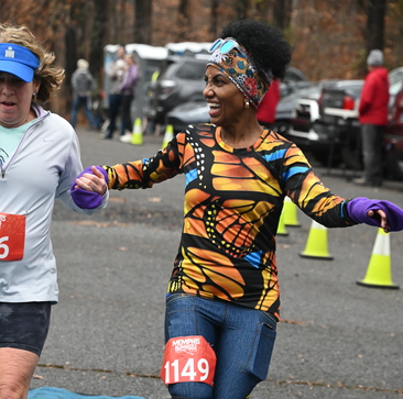 happy laughing woman finishing the race