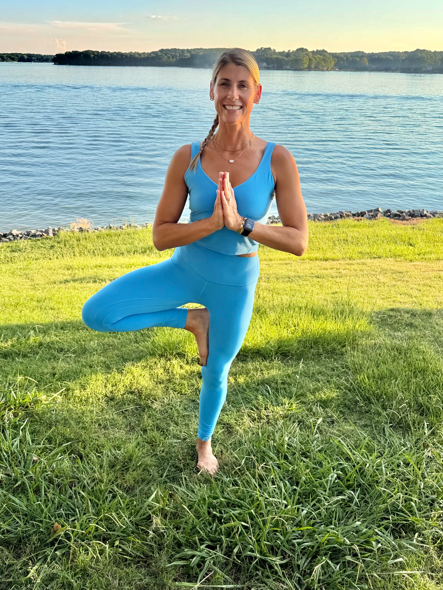 Tatum in Tree pose by the lake
