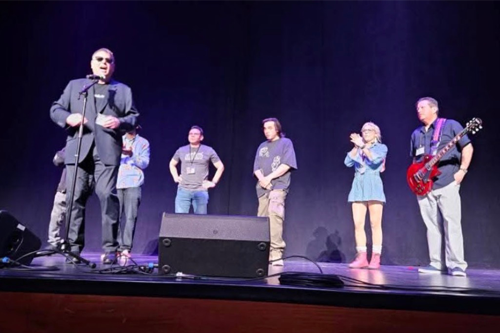 Roger Peterson shares the stage