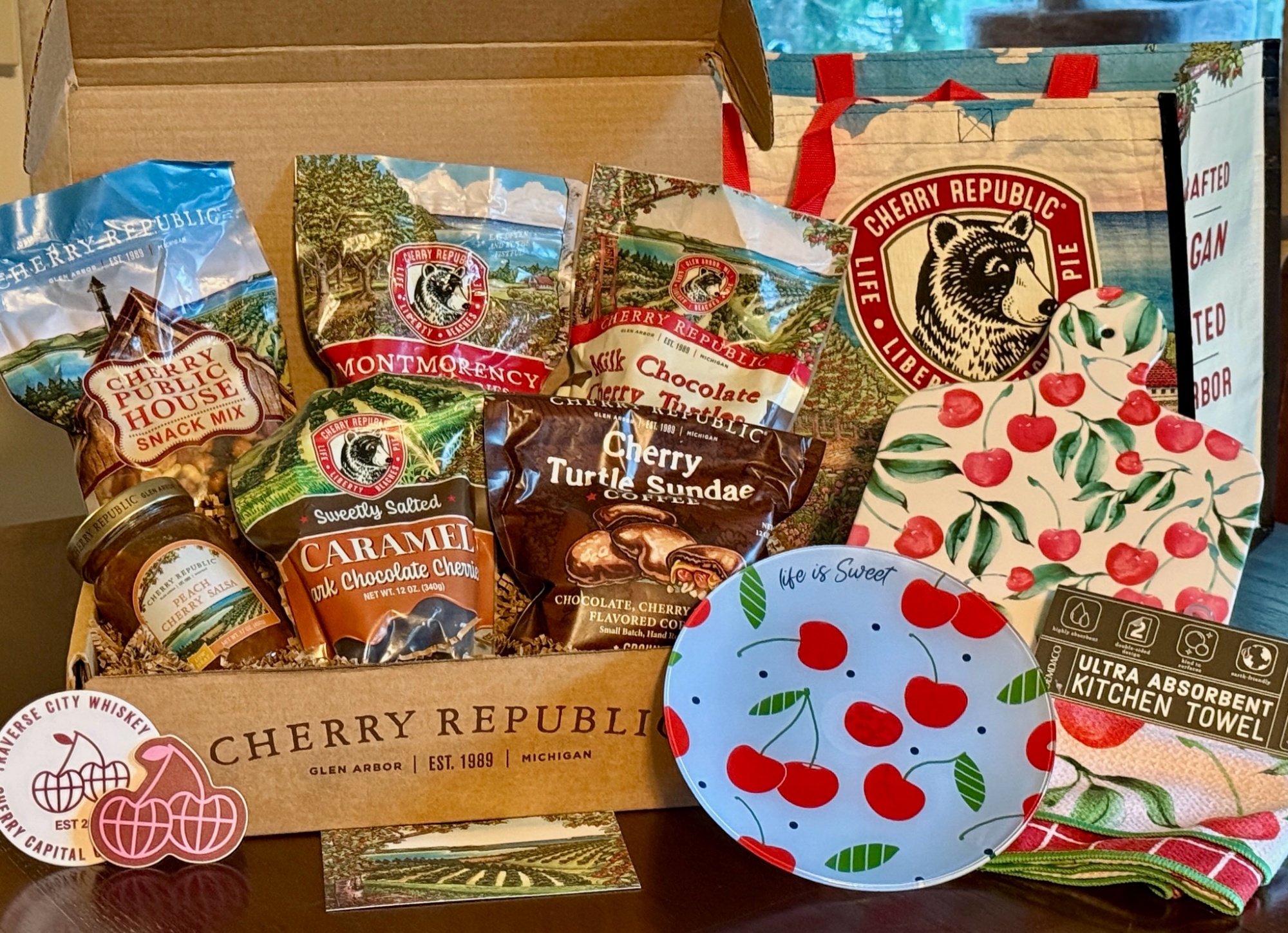 Cherry Republic basket with decorative cutting board, plate and towel