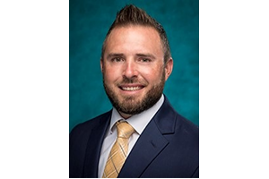Coach Jeff Klaves in a suit and tie