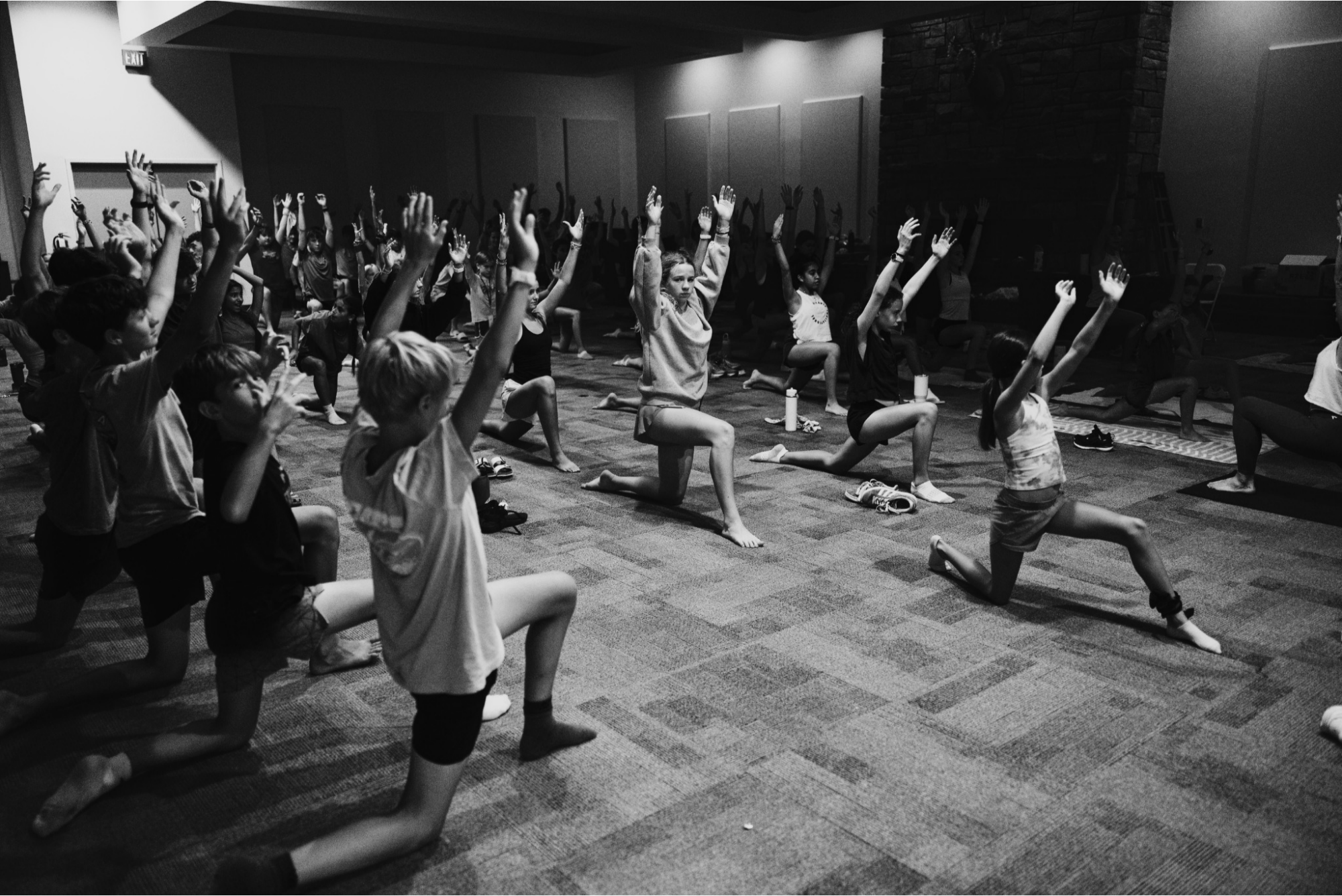 Campers practicing yoga together during an afternoon session