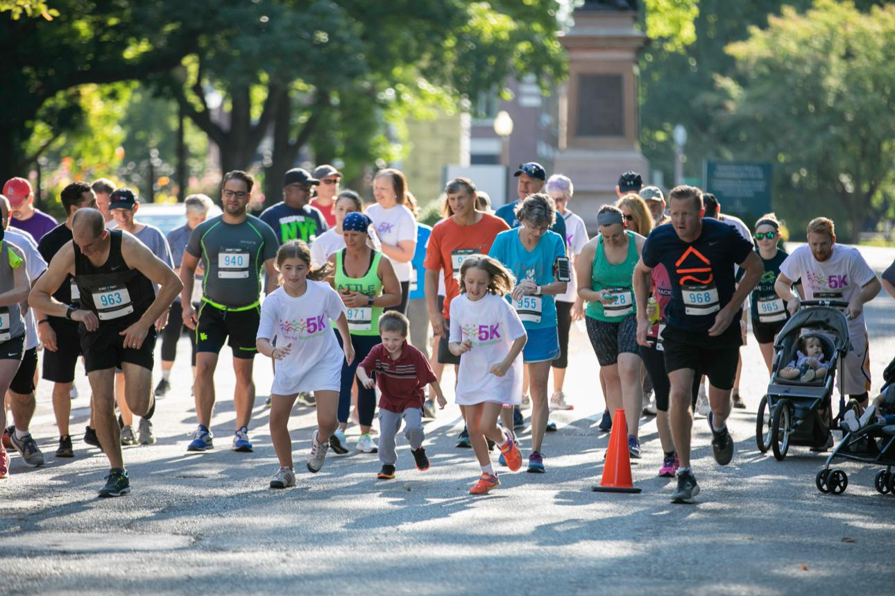 Families and runners participating in a community race