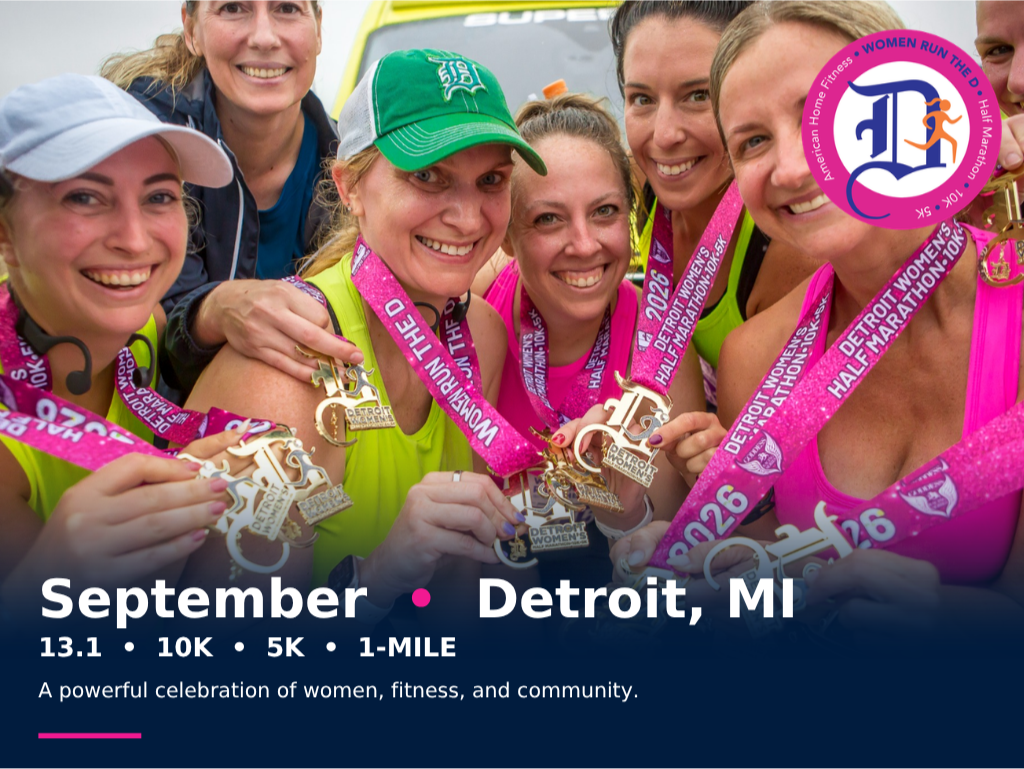 Smiling women showing off their medals after the Detroit Women’s Half Marathon in Belle Isle, Michigan every September